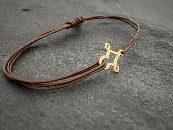 AGADEZ CROSS 14K GOLD CORD BRACELET