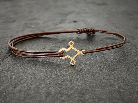 AGADEZ CROSS 14K GOLD CORD BRACELET