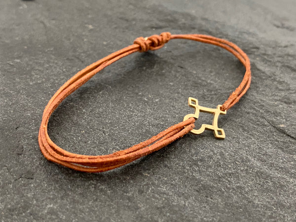 AGADEZ CROSS 14K GOLD CORD BRACELET