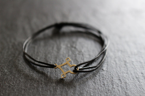 AGADEZ CROSS STERLING SILVER CORD BRACELET