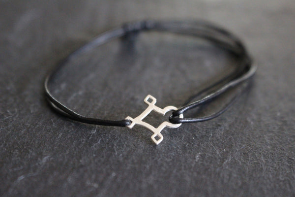 AGADEZ CROSS STERLING SILVER CORD BRACELET