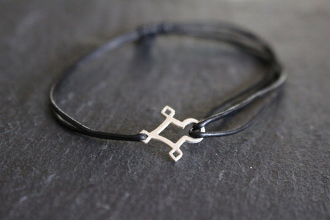 AGADEZ CROSS STERLING SILVER CORD BRACELET