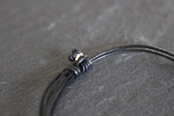 AGADEZ CROSS STERLING SILVER CORD BRACELET