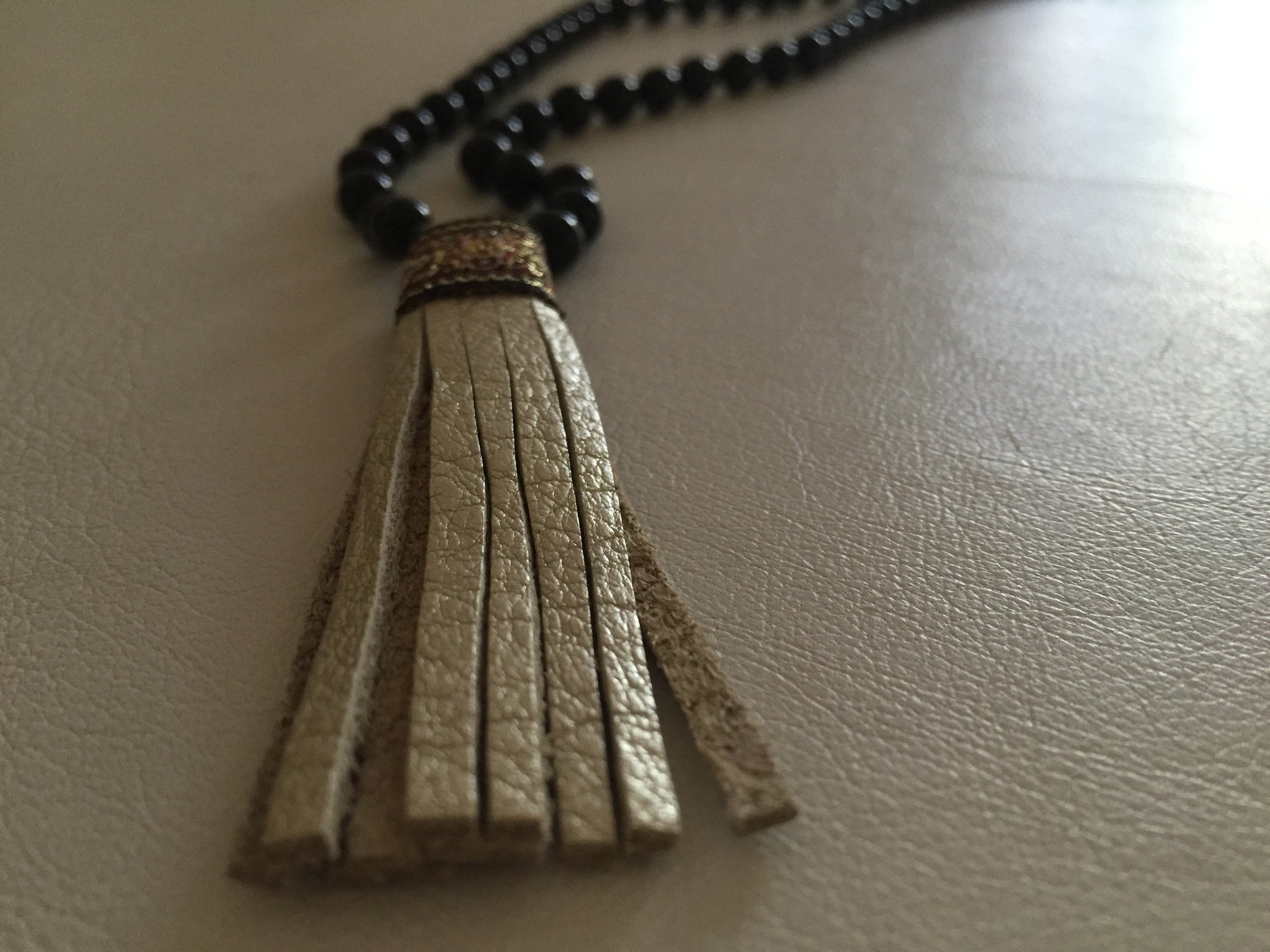 MALA BLACK ONYX GOLD TASSEL