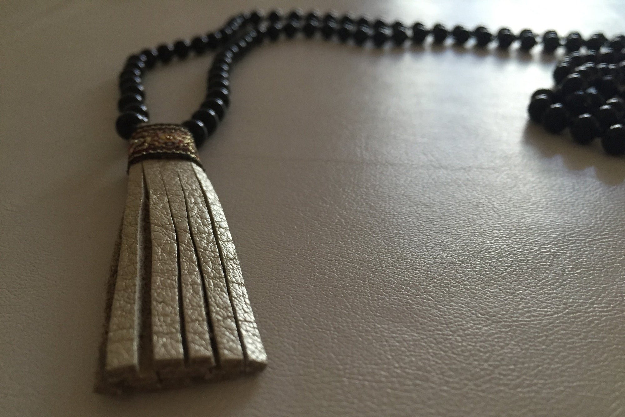 MALA BLACK ONYX GOLD TASSEL
