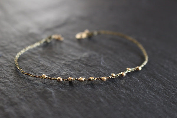 WHEEL OF FORTUNE BLACK GOLD STRING