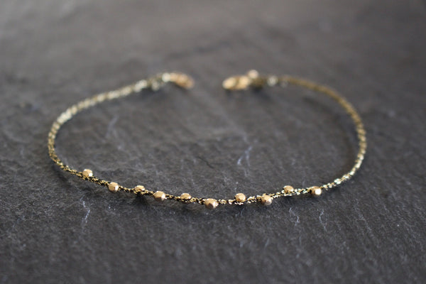 WHEEL OF FORTUNE BLACK GOLD STRING